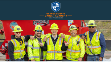 group photo of five landfill laborers