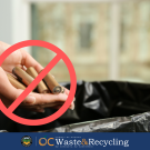 Battery being disposed of in trash with red mark saying no