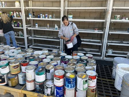 Resident at Materials Exchange Program selecting paint.
