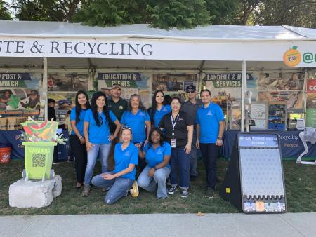 Group of employees at event booth.